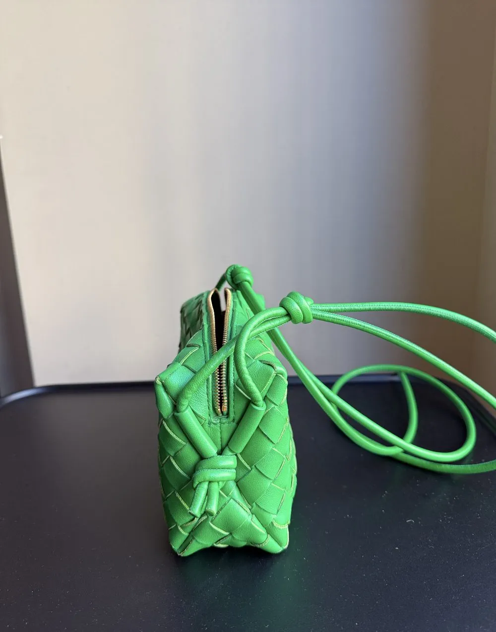 Green Bottega Veneta bag, photographed during a check