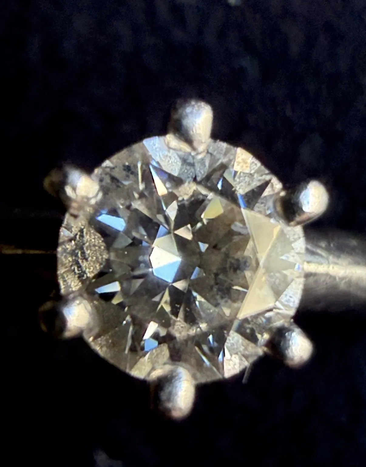 Diamond in the six-prong setting of a Tiffany & Co. ring, macro
